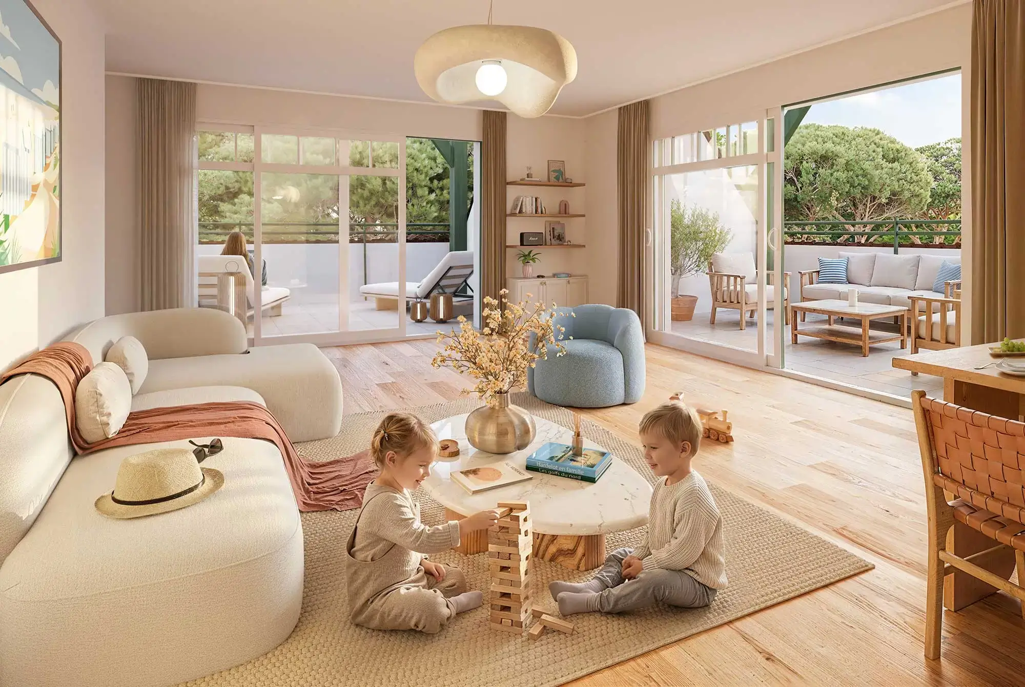 Deux enfants jouant au Jenga dans un vaste séjour lumineux avec double terrasse ouverte sur la verdure, appartement neuf à Hardelot Pré Catelan